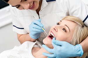 Woman receiving dental exam