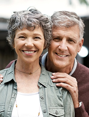 Older man and woman smiling together