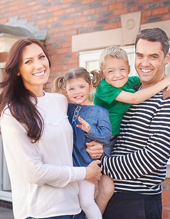 Smiling mother father and two children